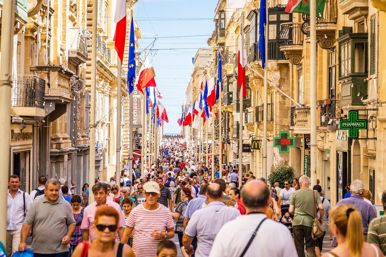 Pedestrians at the narrow streets of Valletta's Old town