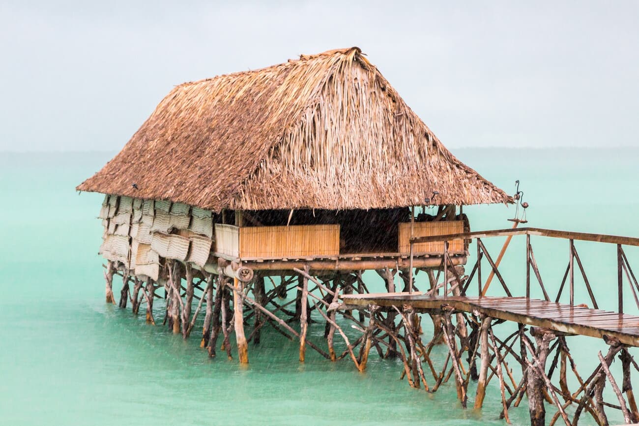 Traditional thatched roof bungalow in the lagoons of South Tarawa