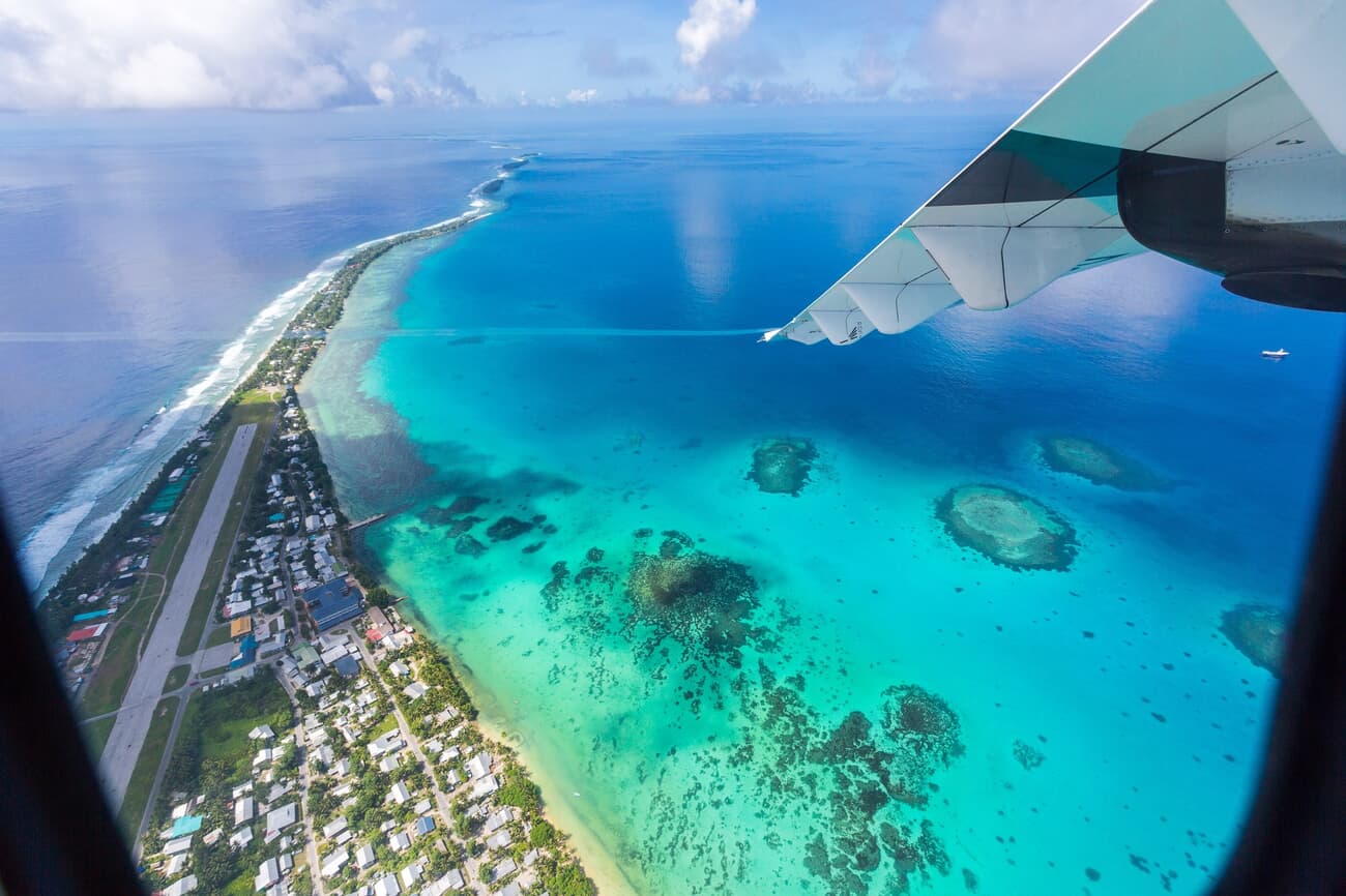 The landscape of Funafuti Atoll, showcasing its narrow land area and surrounding coral reefs