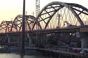 Portal North Bridge arch spans over the Hackensack River at sunset, June 2025