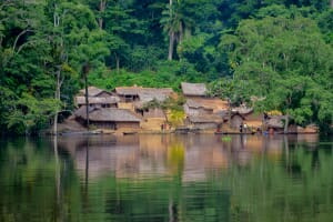 A fishing village on a river in Mongala province, Democratic Republic of the Congo, surrounded by rainforest — characteristic of the remote regions where Ebola repeatedly emerges. The country's 17th outbreak began in May 2026 in Mongbwalu, Ituri Province.